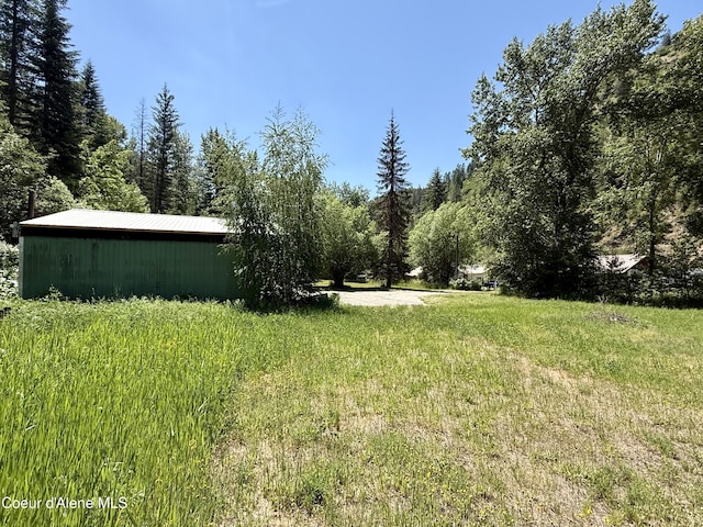1068 Moon Gulch Rd, Kellogg, ID 83837 - view of yard with an outbuilding and a forest view