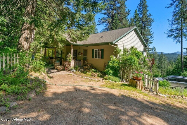 17461 N Right Fork Rd, Hauser, ID 83854 - view of front facade with a porch