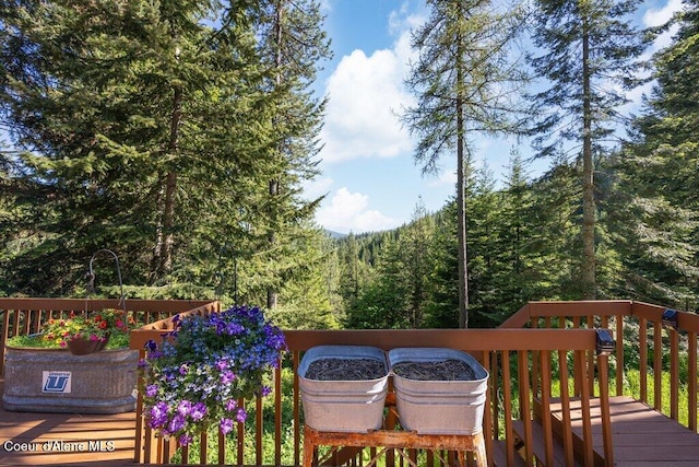 17461 N Right Fork Rd, Hauser, ID 83854 - wooden deck featuring a view of trees