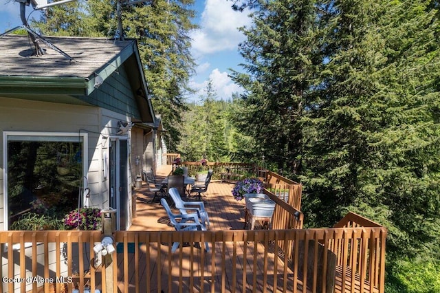 17461 N Right Fork Rd, Hauser, ID 83854 - wooden terrace with outdoor dining area