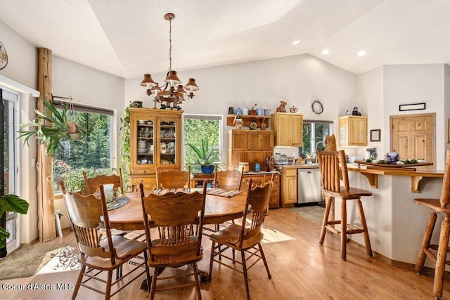 17461 N Right Fork Rd, Hauser, ID 83854 - dining area featuring a chandelier, light wood-style flooring, plenty of natural light, recessed lighting, and high vaulted ceiling