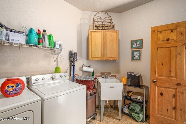 17461 N Right Fork Rd, Hauser, ID 83854 - washroom with cabinet space, washer and clothes dryer, and light tile patterned floors