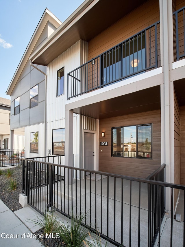 1008 E 4th Ave # 104, Post Falls, ID 83854 - doorway to property featuring a balcony