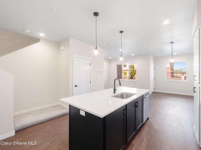 1008 E 4th Ave # 104, Post Falls, ID 83854 - kitchen with a sink, wood finished floors, dark cabinetry, healthy amount of natural light, and recessed lighting