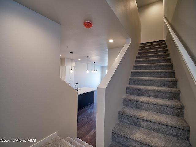 1008 E 4th Ave # 104, Post Falls, ID 83854 - staircase with recessed lighting and wood finished floors
