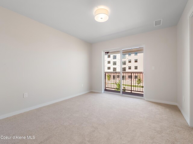 1008 E 4th Ave # 104, Post Falls, ID 83854 - unfurnished room with carpet and baseboards