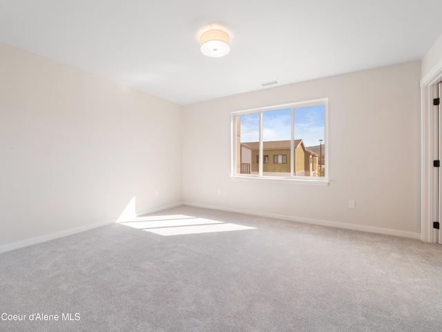 1008 E 4th Ave # 104, Post Falls, ID 83854 - carpeted empty room with baseboards