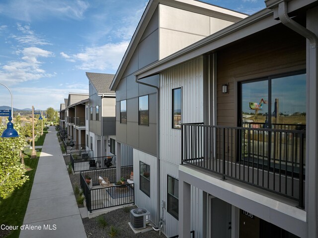 1008 E 4th Ave # 104, Post Falls, ID 83854 - view of side of home featuring central AC unit