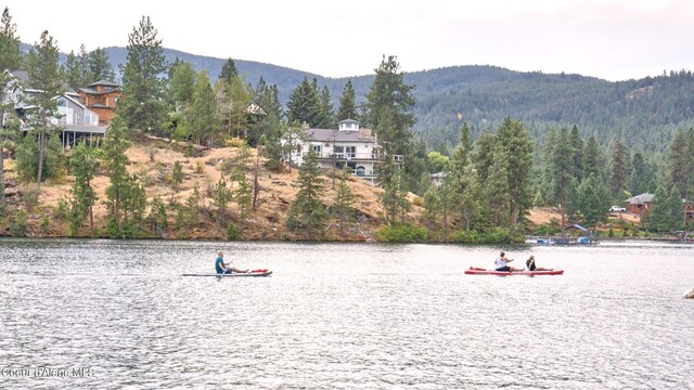 1008 E 4th Ave # 104, Post Falls, ID 83854 - water view featuring a mountainous background and a heavily wooded area