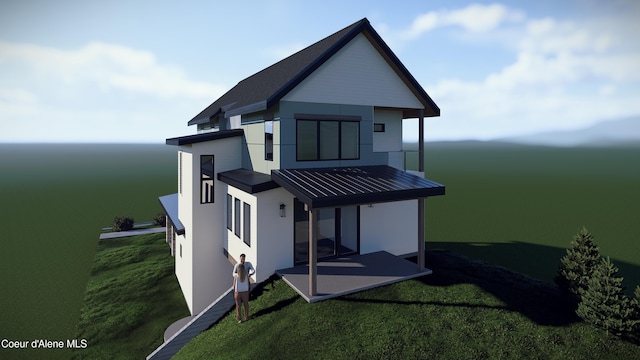 2735 W Lumber Ln, Coeur Dalene, ID 83814 - back of house with a standing seam roof, metal roof, stucco siding, a water view, and a yard