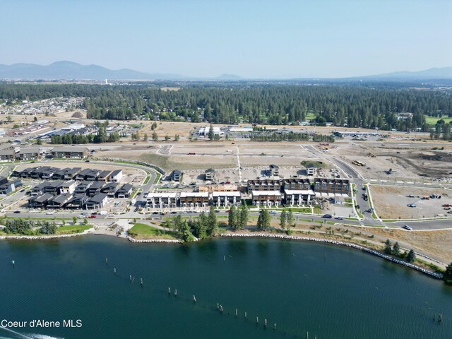 2735 W Lumber Ln, Coeur Dalene, ID 83814 - aerial view of property and surrounding area featuring a water and mountain view and a heavily wooded area