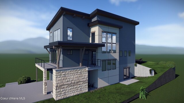 2761 W Lumber Ln, Coeur Dalene, ID 83814 - view of side of property with a yard and a balcony