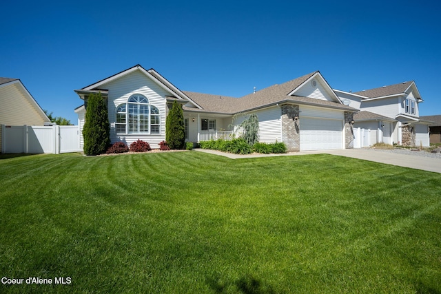 2619 N Tiatan St, Post Falls, ID 83854 - ranch-style home with a garage, concrete driveway, and roof with shingles