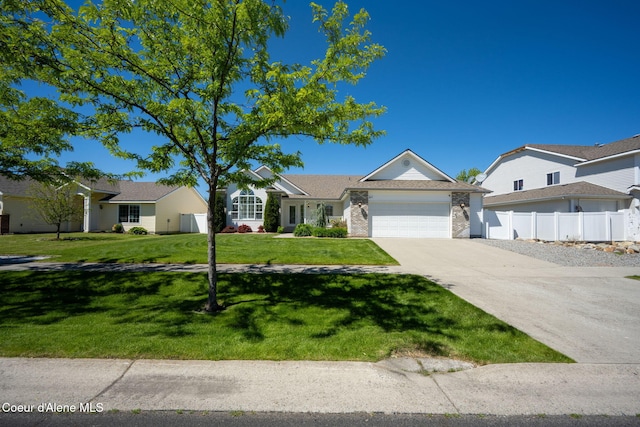 2619 N Tiatan St, Post Falls, ID 83854 - single story home featuring an attached garage, driveway, and brick siding