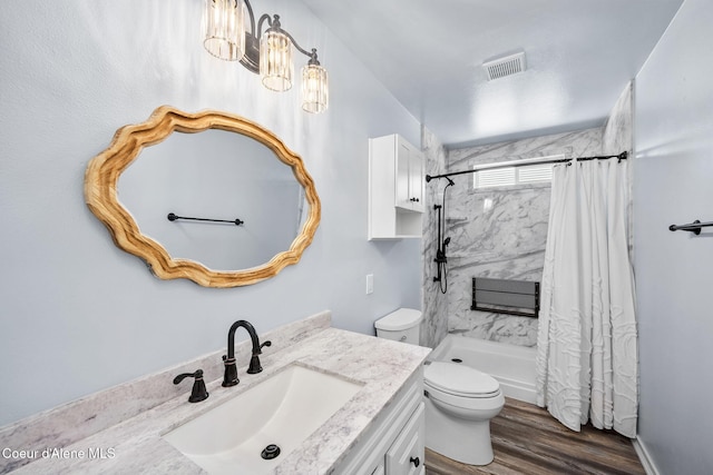 2619 N Tiatan St, Post Falls, ID 83854 - full bath featuring toilet, curtained shower, vanity, and wood finished floors