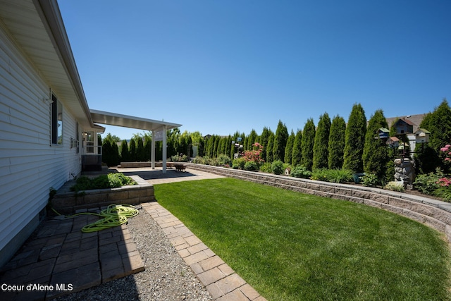 2619 N Tiatan St, Post Falls, ID 83854 - view of green lawn with a patio