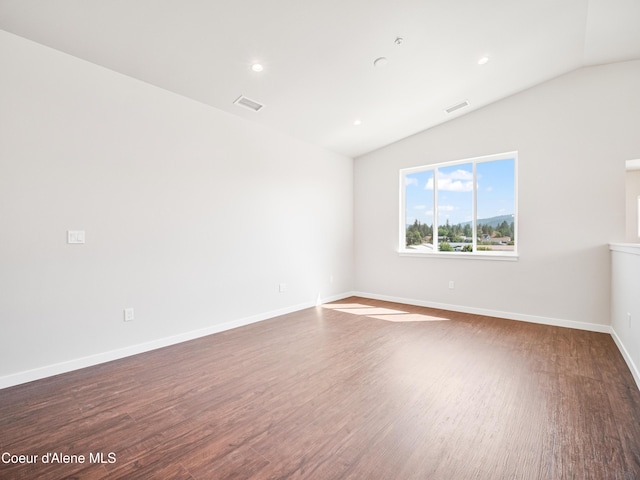 928 E Railroad Ave, Post Falls, ID 83854 - spare room with lofted ceiling, wood finished floors, baseboards, and recessed lighting