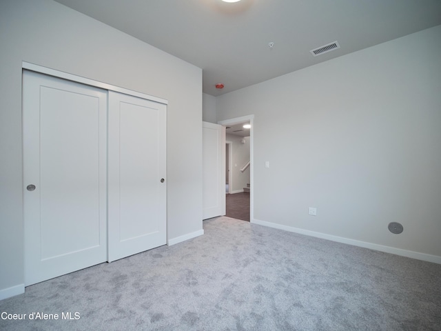 928 E Railroad Ave, Post Falls, ID 83854 - unfurnished bedroom with carpet floors, a closet, and baseboards