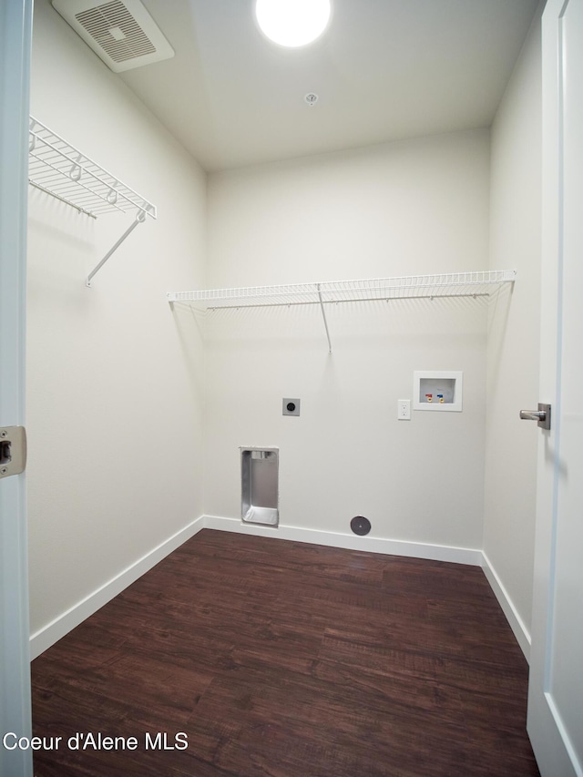 928 E Railroad Ave, Post Falls, ID 83854 - washroom with hookup for a washing machine, wood finished floors, electric dryer hookup, and baseboards