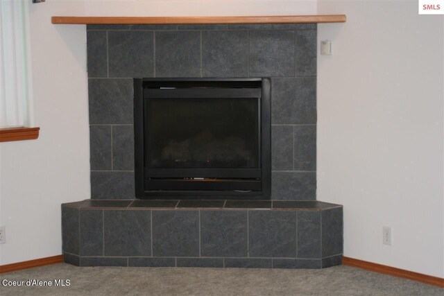 1601 Sequoia St, Sandpoint, ID 83864 - detailed view of carpet floors, a tile fireplace, and baseboards