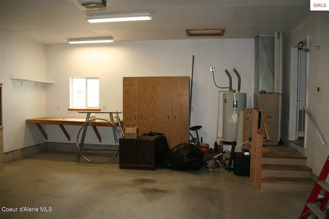 1601 Sequoia St, Sandpoint, ID 83864 - garage with electric water heater and a garage door opener
