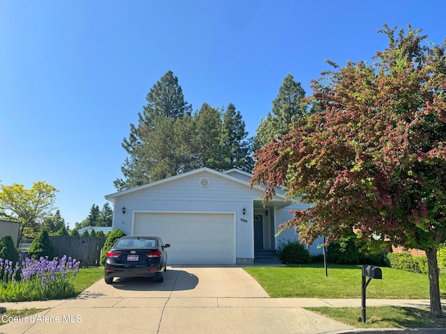 1601 Sequoia St, Sandpoint, ID 83864 - view of front facade featuring driveway, a garage, and board and batten siding