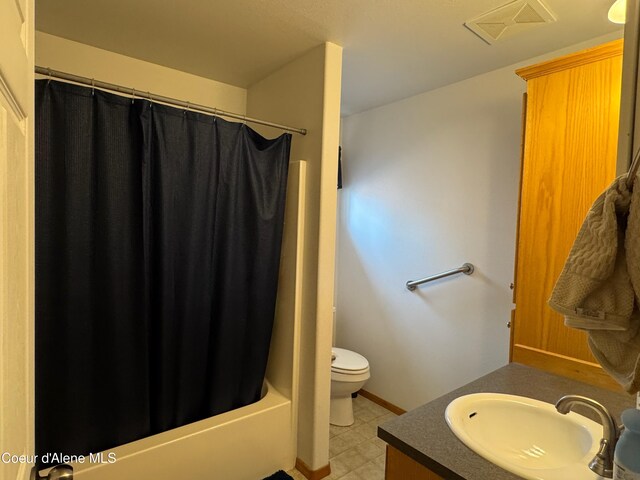 1601 Sequoia St, Sandpoint, ID 83864 - full bath featuring vanity, toilet, shower / bath combo, tile patterned floors, and baseboards