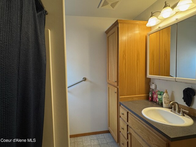 1601 Sequoia St, Sandpoint, ID 83864 - full bathroom featuring vanity and baseboards