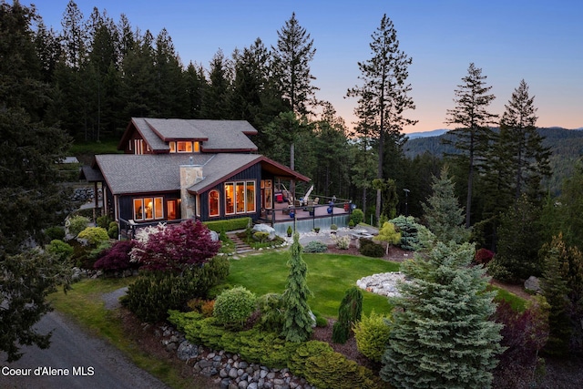 295 Sky Meadow Ln, Sagle, ID 83860 - view of front of house with a wooded view and a front yard