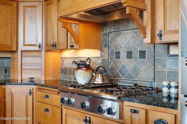 295 Sky Meadow Ln, Sagle, ID 83860 - kitchen featuring decorative backsplash, stainless steel gas stovetop, custom exhaust hood, and brown cabinetry