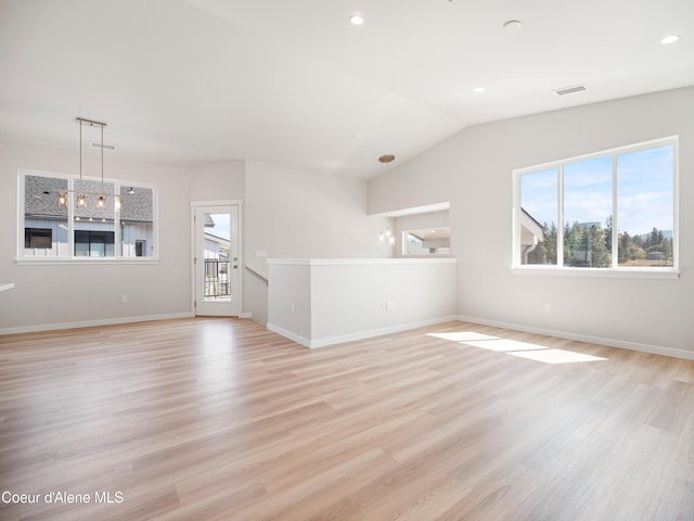 998 E Railroad Ave, Post Falls, ID 83854 - empty room with light wood-style flooring, baseboards, lofted ceiling, and recessed lighting