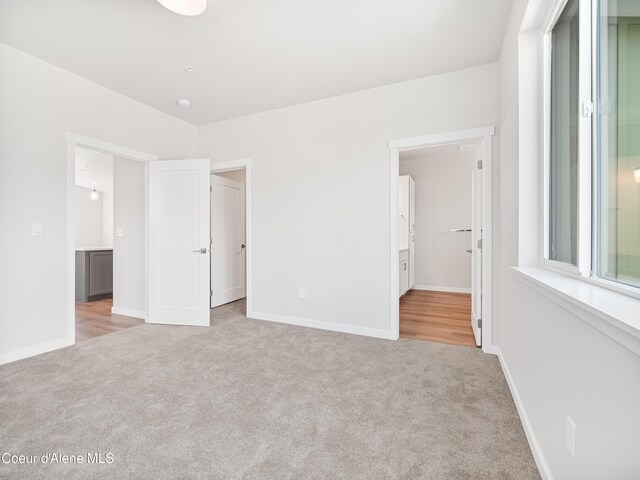 998 E Railroad Ave, Post Falls, ID 83854 - unfurnished bedroom featuring carpet, baseboards, and a spacious closet