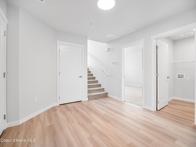 998 E Railroad Ave, Post Falls, ID 83854 - below grade area with light wood-style floors, stairway, and baseboards