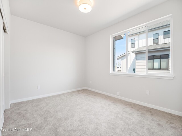 998 E Railroad Ave, Post Falls, ID 83854 - spare room featuring carpet flooring and baseboards