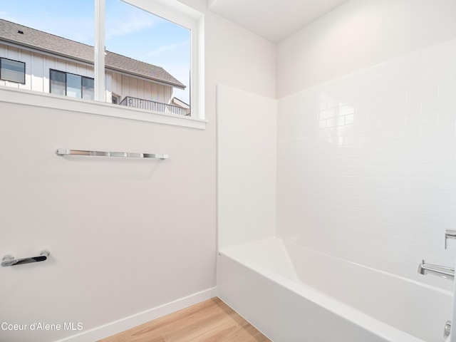 998 E Railroad Ave, Post Falls, ID 83854 - bathroom with wood finished floors, baseboards, and bathtub / shower combination