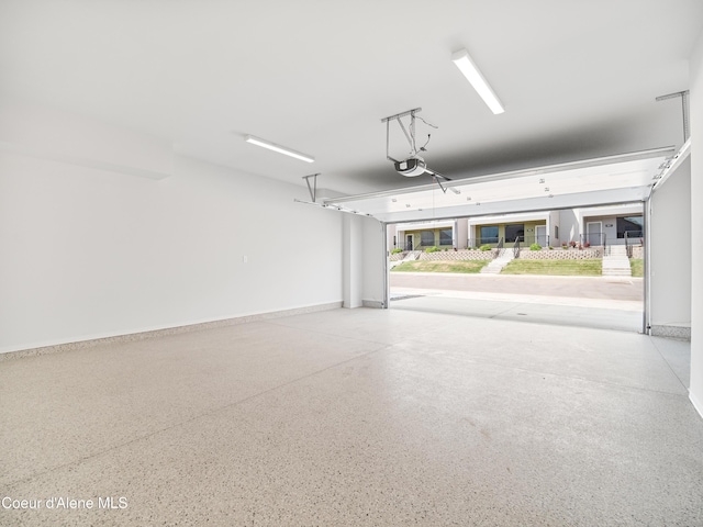 998 E Railroad Ave, Post Falls, ID 83854 - garage featuring a garage door opener and baseboards