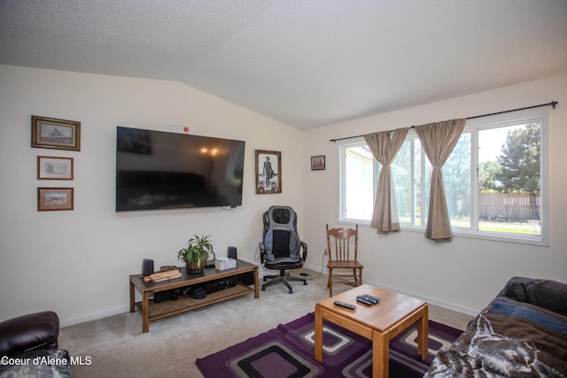3420 E Poleline Ave, Post Falls, ID 83854 - carpeted living room featuring lofted ceiling and baseboards