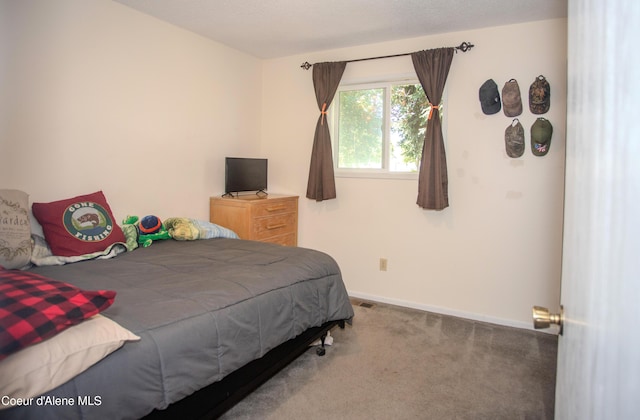 3420 E Poleline Ave, Post Falls, ID 83854 - carpeted bedroom featuring baseboards