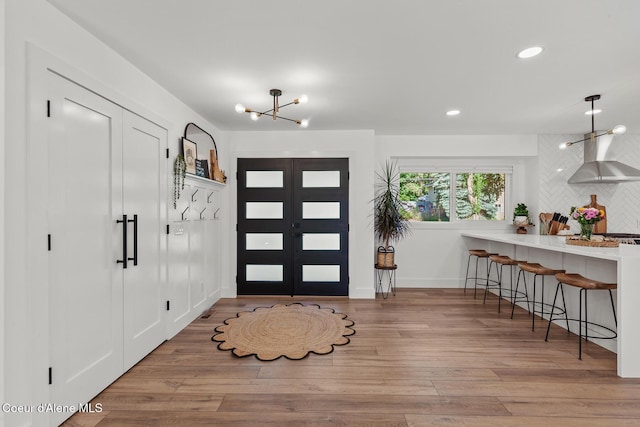 1113 N Lambert Ln, Coeur Dalene, ID 83814 - foyer featuring a chandelier, wood finished floors, recessed lighting, and baseboards