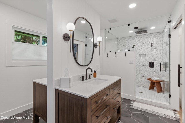 1113 N Lambert Ln, Coeur Dalene, ID 83814 - full bath featuring vanity, a stall shower, recessed lighting, and tile patterned floors