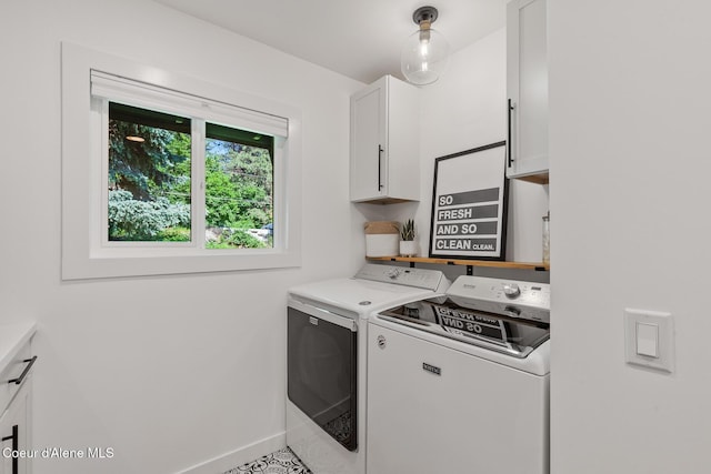 1113 N Lambert Ln, Coeur Dalene, ID 83814 - laundry room with cabinet space, independent washer and dryer, and baseboards