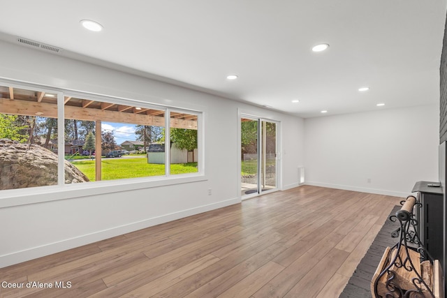 1113 N Lambert Ln, Coeur Dalene, ID 83814 - unfurnished living room featuring light wood-style flooring, baseboards, and recessed lighting