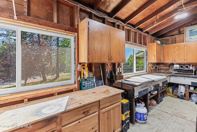 1113 N Lambert Ln, Coeur Dalene, ID 83814 - kitchen featuring lofted ceiling, light countertops, and unfinished concrete floors