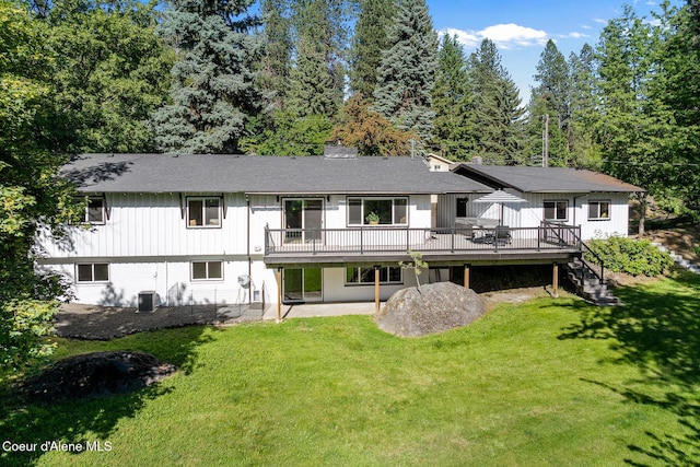 1113 N Lambert Ln, Coeur Dalene, ID 83814 - rear view of house featuring a deck, a yard, a patio area, and central AC unit