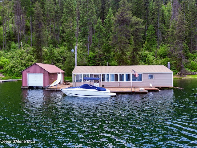 11 Hidden Lake Trl, Plummer, ID 83851 - dock area with a wooded view, a water view, and boat lift