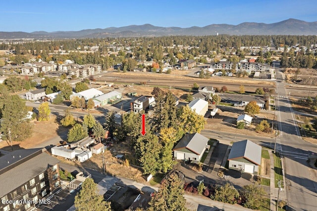 504 E 3rd Ave, Post Falls, ID 83854 - aerial view of property's location with nearby suburban area and a mountain backdrop