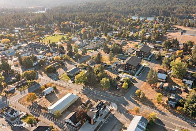 504 E 3rd Ave, Post Falls, ID 83854 - aerial view of property and surrounding area featuring a forest