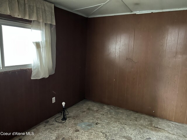 504 E 3rd Ave, Post Falls, ID 83854 - empty room with wood walls