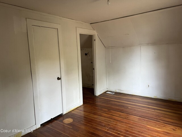 504 E 3rd Ave, Post Falls, ID 83854 - unfurnished bedroom with dark wood-style flooring and vaulted ceiling