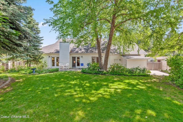 8511 N Summerfield Loop, Hayden, ID 83835 - rear view of house featuring french doors and a patio area